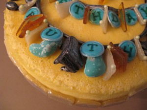 Closeup of Chubby Chocolate Piano & Collage Necklace Cheesecake