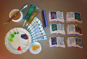 Adding the stained glass gel frostings and final edge details to the Beauty & the Beast Bookookies