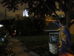 Trick or Treater pointing at a ghost