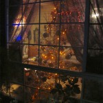 Halloween tree and spiderweb lace curtains frame the Undead Room