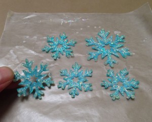 Small fabric snowflakes reinforced with crystal glitter paint