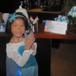 Violet Elsa shows off a custom snowflake cup by Olaf's Summer Cocktails