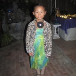 V's lovely blue-green dress and fashionable leopard coat!