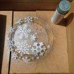 Snowflake labels as stencils with aqua glitter spray paint