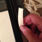 Hand ripping paper strips for the book page edges