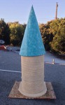 Spire tucked onto the tower in the nested foam base