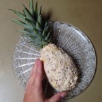 Patting the cheese mixture into pineapple shape