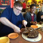 Cutting the Peanut Butter Brownie Cake 