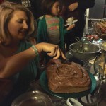Birthday girl cutting the delicious chocolate cake
