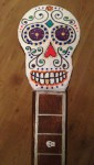 Skull tuning head and skull fret marker on the guitar