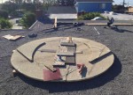 Repairing and reinforcing the 8-foot moon screen up on the roof