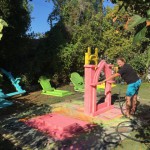 Yours truly spraying colorful Mexican-inspired basecoats on plain white foam gravestones...