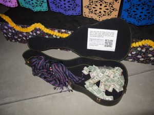 Grand total of $219.84 of donations to UNICEF in Ricardo's guitar case