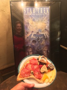 Lt. Peterson's dinner: Starfleetza grilled pizza, Reboot Rollup, Federation Fruit Salad, Chevron Cheese, Commbadge Chocolate, and S'more Trek!