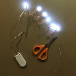 Mini battery pack LED lights on copper wire