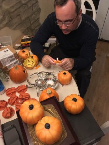 Ghoulish Glen Electrical Engineer hard at work hacking baby jack o' lanterns, replacing bulbs and power supplies...