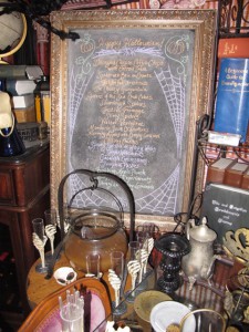 Menu chalkboard with glass cauldron of Bobbing Apple Punch