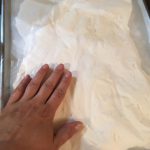 Smoothing the surface of the homemade marshmallows